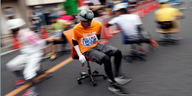 Racers compete in an office chair race in Hanyu, Japan, on Sunday.