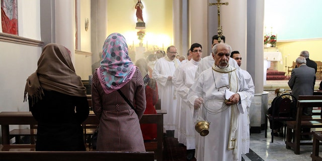 Tehran, Iran: Christian pilgrims attend a mass led by Chaldean Catholic archbishop of Tehran Ramzi Garmou (not seen) during Christmas celebrations at the St. Joseph Catholic Church in Tehran, Iran, on December 25, 2014. (Photo by Fatemeh Bahrami/Anadolu Agency/Getty Images)