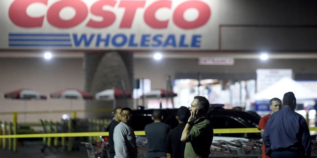 A Costco employee speaks on the phone as a result of a shootout in the wholesale store in Corona, California on Friday, June 14, 2019.