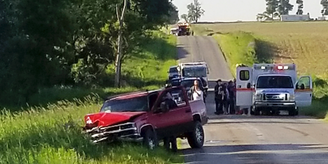 A damaged truck sits on the side of the road after an accident involving a horse-drawn carriage on Friday, June 7, 2019 in California Township, Mich. Michigan State Police said the pick up truck was headed southbound when the driver rear ended an Amish, horse-drawn carriage. Two adults and five children were ejected from the carriage. (Don Reid/The Daily Reporter via AP)
