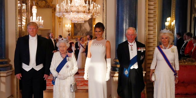 From left, US President Donald Trump, Britain's Queen Elizabeth II, first lady Melania Trump, Prince Charles and Camilla, the Duchess of Cornwall pose for the media ahead of the State Banquet at Buckingham Palace. 