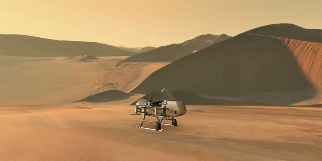 This illustration shows NASA’s Dragonfly rotorcraft-lander approaching a site on Saturn’s exotic moon, Titan. Taking advantage of Titan’s dense atmosphere and low gravity, Dragonfly will explore dozens of locations across the icy world, sampling and measuring the compositions of Titan's organic surface materials to characterize the habitability of Titan’s environment and investigate the progression of prebiotic chemistry. Credits: NASA/JHU-APL