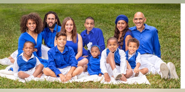 Tony Dungy and his wife Lauren, with 9 of their children.The Dungys have three biological children, seven adopted children, and a foster child.