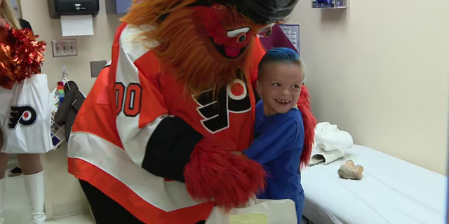 Caiden O'Rourke hugs Philadelphia Flyers mascot Gritty Tuesday, June 25 during a surprise visit by the mascot.
