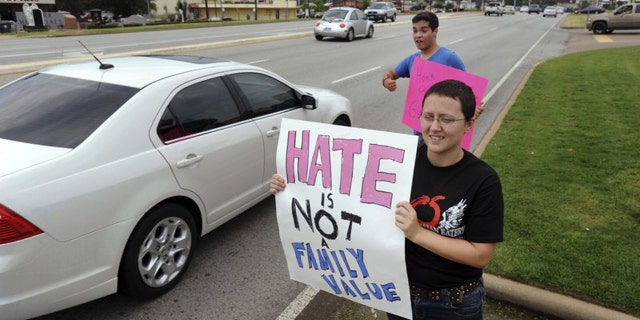 Texans holding signs supporting gay marriage outside of a Chick-fil-A in Tyler, in 2012.