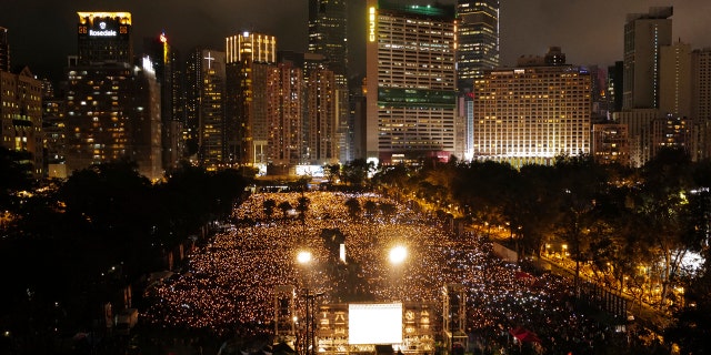 Many thousands of people attend a candlelight vigil for victims of the Chinese government's brutal military crackdown three decades ago on protesters in Beijing's Tiananmen Square at Victoria Park in Hong Kong Tuesday, June 4, 2019.