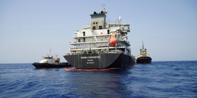 The Panama-flagged, Japanese owned oil tanker Kokuka Courageous, that the U.S. Navy says was damaged by a limpet mine, is anchored off Fujairah, United Arab Emirates, during a trip organized by the Navy for journalists, Wednesday, June 19, 2019.