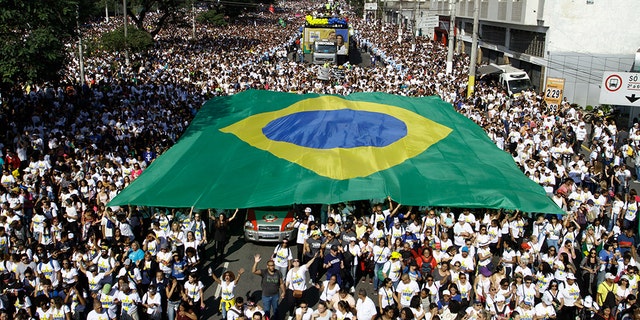 People take part in the 27th edition of March for Jesus, in Sao Paulo, Brazil, on June 20, 2019. "March For Jesus" is the largest evangelical event in Brazil. (Photo by Fabio Vieira/FotoRua/NurPhoto via Getty Images)