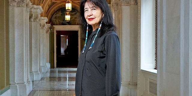 In this June 6, 2019 photo, Joy Harjo, of the United States, poses inside the Library of Congress, in Washington. Harjo has been named the country’s next poet laureate, becoming the first Native American to hold that position. Librarian of Congress Carla Hayden announced Harjo’s appointment, saying in a statement Wednesday, June 19 that the poet helped tell an American story of continuity and disruption, “reckoning and myth-making.” Harjo’s one-year term begins this fall. She succeeds Tracy K. Smith, who served two terms.