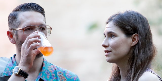 Amanda Knox, right, and her boyfriend Christopher Robinson attend a cocktail for the opening of the Innocence Project conference, in Modena, Italy, Thursday, June 13, 2019.