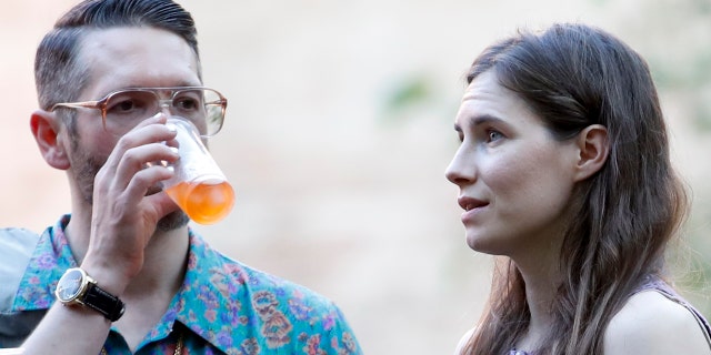 Amanda Knox, right, and her boyfriend Christopher Robinson attend a cocktail for the opening of the Innocence Project conference, in Modena, Italy, Thursday, June 13, 2019. (AP Photo/Antonio Calanni)(AP Photo/Antonio calanni)