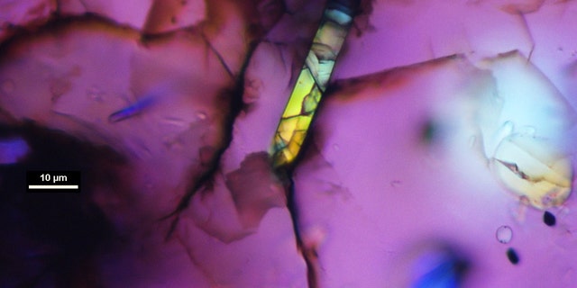 Tiny igneous zircon grains within this rock fragment were fractured by the launch from Mars but otherwise unaltered for more than 4.4 billion years. The images was taken with an optical polarizing compound microscope Western’s Zircon & Accessory Phase Laboratory. (Credit: Desmond Moser, Western University)