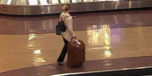 Lueck at a baggage claim area at Salt Lake City International Airport.