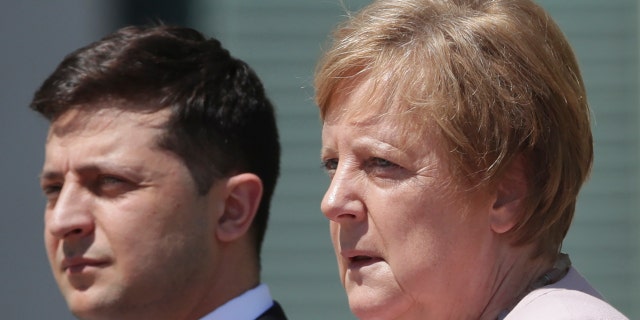 German Chancellor Angela Merkel welcomes Ukraine's President Volodymyr Zelenskiy with military honors for a meeting at the chancellery in Berlin, Germany, Tuesday, June 18, 2019.