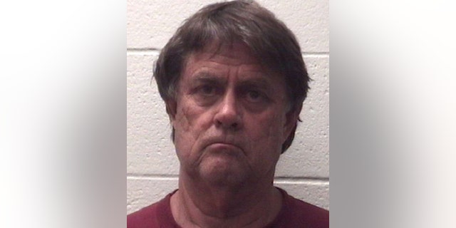 Sherman Shirley Fricks, 68, was charged with murder for allegedly shooting his son, then having a 20-minute "father-son" conversation before stabbing him to death in Deer Park, Texas, on Sunday.