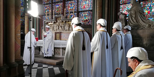For security reasons, only about 30 people — mainly priests, canons and church employees — were admitted inside the cathedral for the service, while Aupetit and others wore construction worker's helmets. Some of the workers rebuilding the church were also invited.