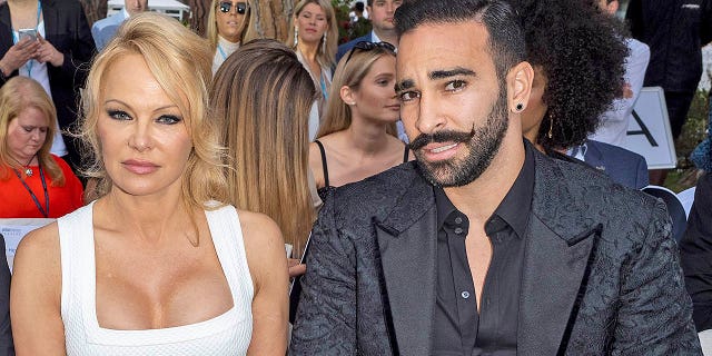 Pamela Anderson and Adil Rami attend Amber Lounge 2019 Fashion Show on May 24, 2019 in Monte-Carlo, Monaco. The couple, who dated for two years, recently split and Anderson accused the soccer star of cheating and