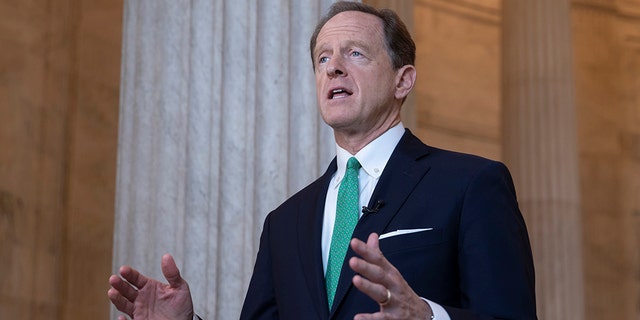 In this Oct. 2, 2018, file photo, Sen. Pat Toomey, R-Pa., speaks during a television news interview on Capitol Hill in Washington. Toomey Tuesday said he supports Senate Republicans' plan to process a Trump nominee to replace late Supreme Court Justice Ruth Bader Ginsburg ahead of the election. (AP Photo/J. Scott Applewhite, file)