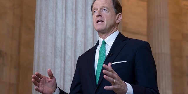 In this Oct. 2, 2018, file photo, Sen. Pat Toomey, R-Pa., speaks during a television news interview on Capitol Hill in Washington. Toomey Tuesday said he supports Senate Republicans' plan to process a Trump nominee to replace late Supreme Court Justice Ruth Bader Ginsburg ahead of the election. (AP Photo/J. Scott Applewhite, file)