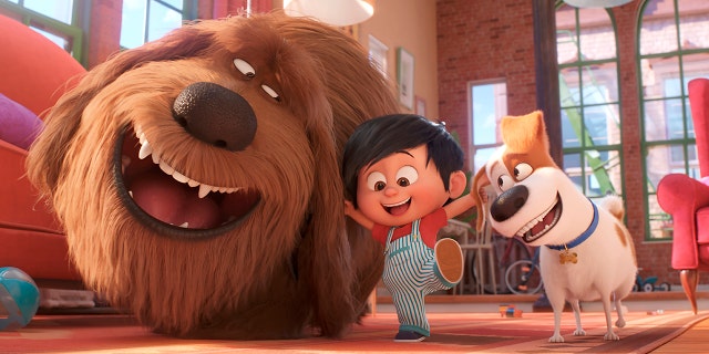 This image released by Universal Pictures shows, from left, Duke, voiced by Eric Stonestreet, Liam, voiced by Henry Lynch and Max, voiced by Patton Oswalt in a scene from "The Secret Life of Pets 2." (Illumination Entertainment/Universal Pictures via AP)