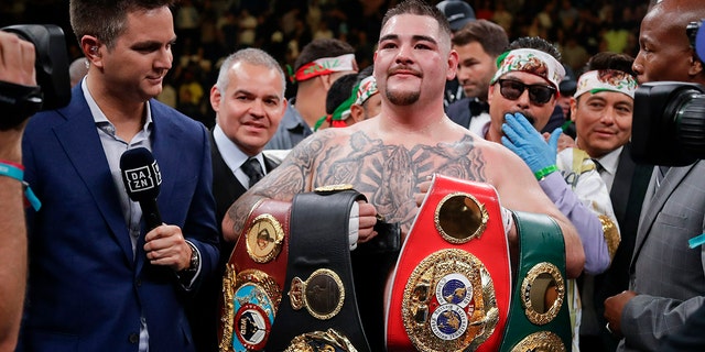 Andy Ruiz poses for photographs after a heavyweight title boxing match against Anthony Joshua. (AP)