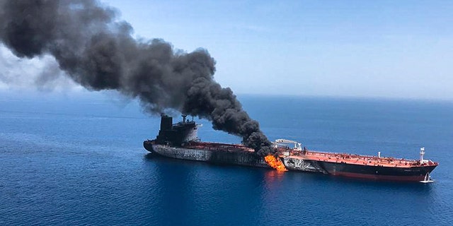 An oil tanker is on fire in the sea of Oman, Thursday, June 13, 2019. Two oil tankers near the strategic Strait of Hormuz were reportedly attacked on Thursday, an assault that left one ablaze and adrift as sailors were evacuated from both vessels and the U.S. Navy rushed to assist amid heightened tensions between Washington and Tehran.