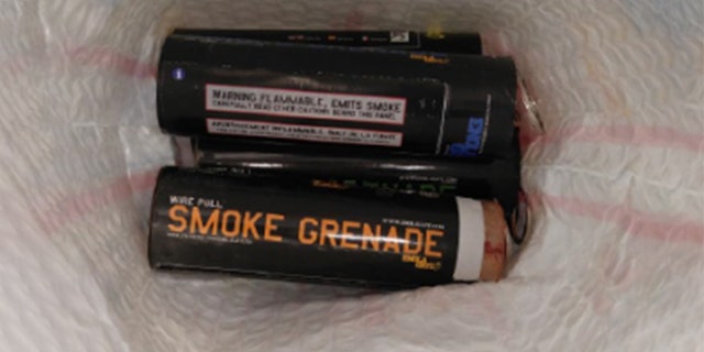 An image of the smoke grenades found in a man's carry-on bag at Newark Liberty International Airport on Sunday.