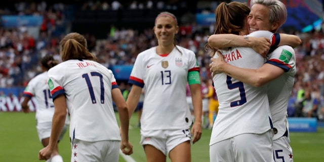 United States' Megan Rapinoe, right, celebrates with teammates after scoring her team's first goal during the Women's World Cup quarterfinal soccer match between France and the United States at Parc des Princes in Paris, France, Friday, June 28, 2019. (AP Photo/Alessandra Tarantino)