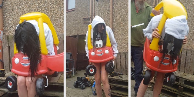 Zoe Archibald managed to get stuck in the children's toy car during a family gathering on Friday.