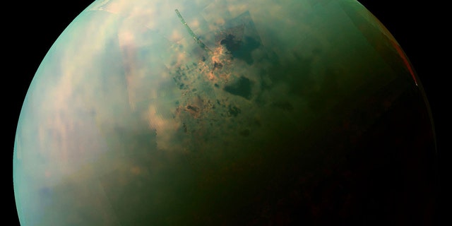 A false-color, near infrared view of Titan’s northern hemisphere collected by NASA’s Cassini spacecraft showing the moon’s seas and lakes. Orange areas near some of them may be deposits of organic evaporite minerals left behind by receding liquid hydrocarbon. (Credit: NASA / JPL-Caltech / Space Science Institute)