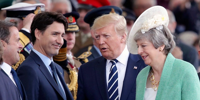 Canadian Prime Minister Justin Trudeau, US President Donald Trump and Britain's Prime Minister Theresa May attend commemorations for the 75th Anniversary of the D-Day landings in Portsmouth, England, on Wednesday.