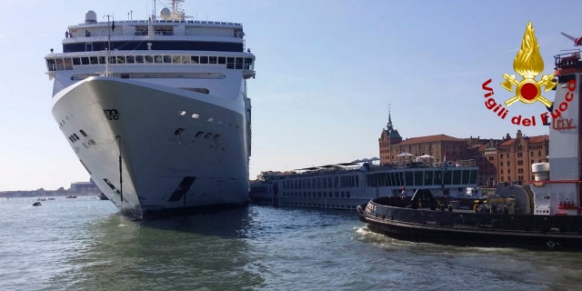 The MSC Opera cruise liner stands by a tourist boat following a collision in Venice, Italy, June 2, 2019. (Vigili del Fuoco via AP)