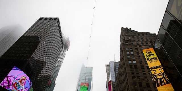 A high-wire crosses Times Square, Thursday, June 20, 2019 in New York. Performers Nik and Lijana Wallenda will cross Times Square on the high wire on Sunday. (AP Photo/Mark Lennihan)