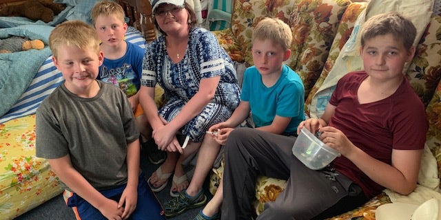 Amberly Coffman, 38, is living in a vacant home several miles away with her sons amid the devastation in Webbers Falls