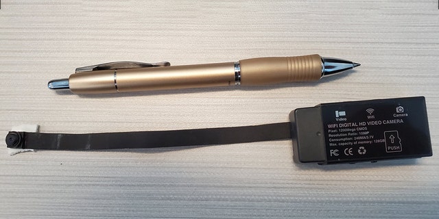 The small camera, which is a little larger than a standard ball-point pen, was discovered on the underside on the toilet lid.