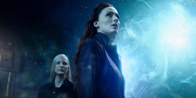 This image published by Twentieth Century Fox shows Sophie Turner and Jessica Chastain, left, in a scene from 