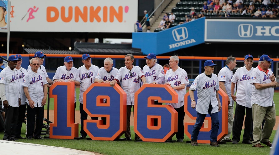 The 1969 Mets leave the field after a pre-game ceremony to honor them before a baseball game against the Atlanta Braves Saturday. (AP Photo/Frank Franklin II)