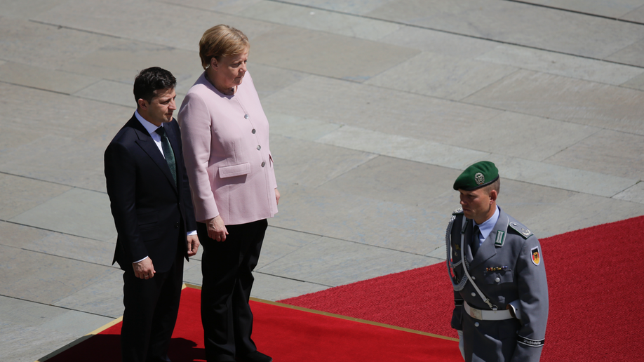 Angela Merkel, Seen Trembling At Official Ceremony, Says She's Angela Merkel, Seen Trembling At Official Ceremony, Says She's