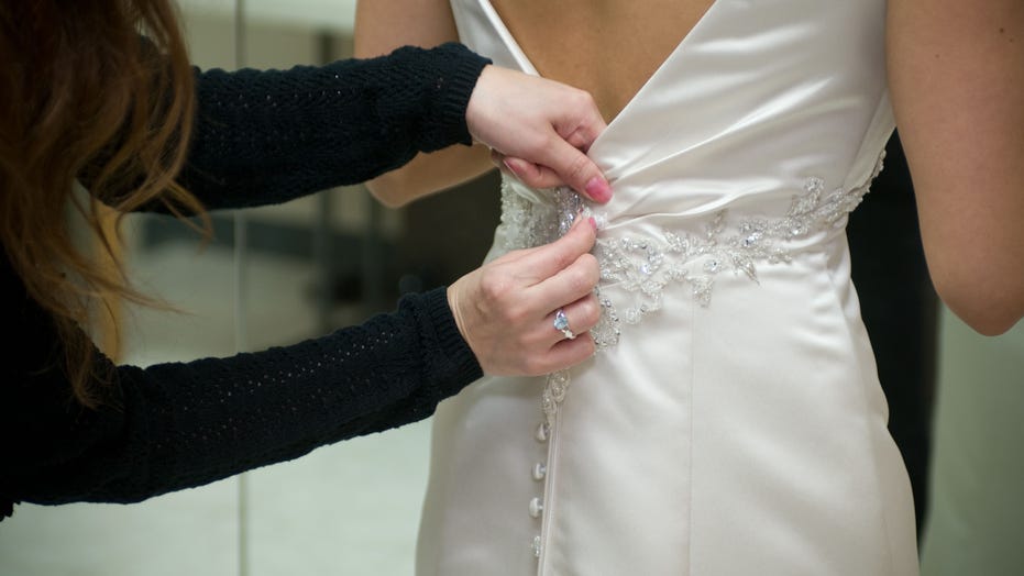 mother wears wedding dress to son's wedding