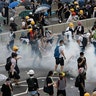 Riot police fire tear gas on protesters outside the Legislative Council in Hong Kong, June 12, 2019. 