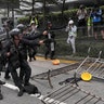 Police use pepper spray on protesters near the Legislative Council in Hong Kong, June 12, 2019. 