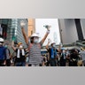 Demonstrators stand up to police near the Legislative Council in Hong Kong, June 12, 2019.?