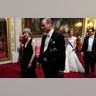 Prime Minister Theresa May, left, and Prince William, Duke of Cambridge, followed by Kate, the Duchess of Cambridge, and U.S. Treasury Secretary Steven Mnuchin.