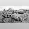 Dummy Landing Craft and Tanks -?It wasn't just shoulder patches that were created to help make the ghost army appear real. Inflatable tanks were positioned around Dover while landing craft made of thin wood and canvas were also deployed. However, by the spring of 1944 German reconnaissance flights were rare – and that was probably good news for the Allies.The light landing craft had a bad habit of blowing away in heavy winds, while at least one English farmer's bulls decided to take on the rubber tank. Not unexpectedly the bull won that fight.?This image is a file photo of a British dummy tank.