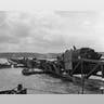 Mulberry Harbours -The Allies knew that it wouldn't be easy to capture a French or Belgian harbor intact, so Allied planners instead opted to create two artificial harbors, which were codenamed "Mulberries." These required the sinking of outdated ships or "Corncobs" to create the outer breakwater or "Gooseberries," along with large concrete structures "Phoenixes." Floating roadways and piers were codenamed "Whales" and the result was an improvised port facility. Unfortunately, a major storm on June 19 completely destroyed the one at Omaha Beach, while the second one at Gold Beach – which became known as Port Winston – actually saw use for eight months. That was five months longer than its expected life cycle. It was used to land more than 2.5 million men, 500,000 vehicles and more than four million tons of supplies. This photo shows the 'Mulberry' floating harbor at Omaha beach.