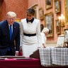Queen Elizabeth II looking at a display of U.S. items of the Royal Collection with President Trump and first lady Melania Trump at Buckingham Palace.
