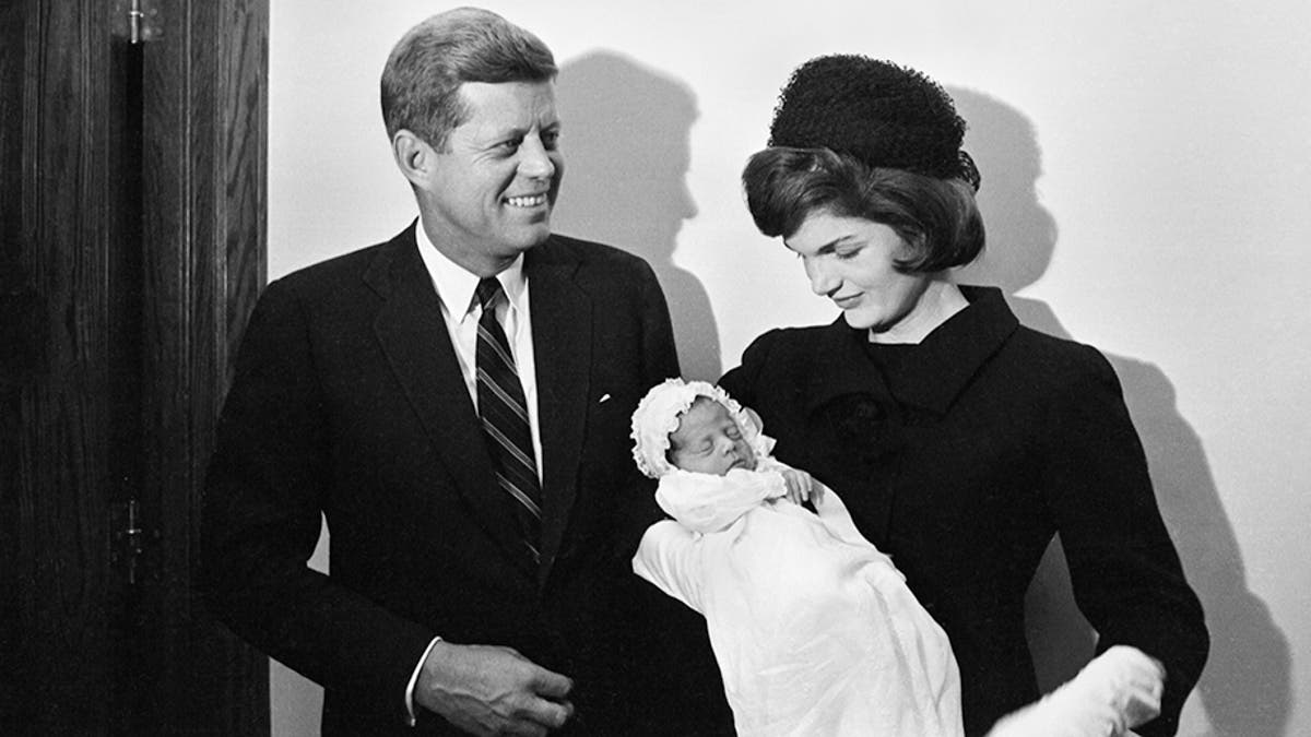 President John F. Kennedy and first lady Jacqueline Kennedy are seen with their newborn son, John F. Kennedy Jr.