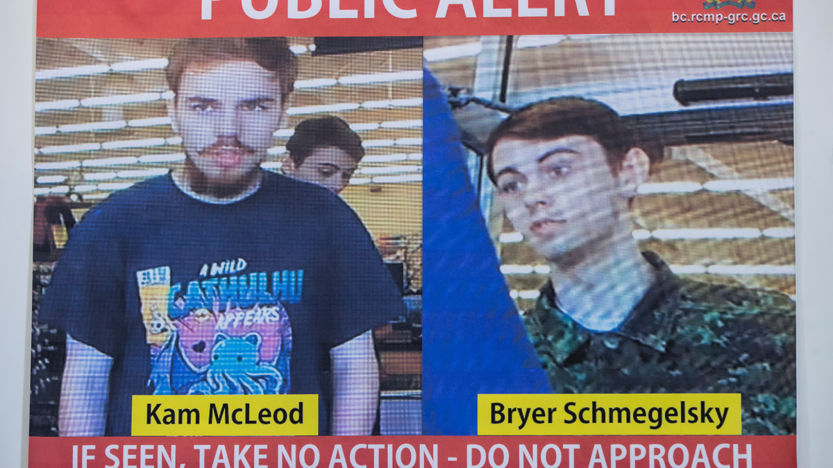 Security camera images of Kam McLeod, 19, and Bryer Schmegelsky, 18, are displayed during a news conference in Surrey, British Columbia, Tuesday, July 23, 2019. The two young men, thought to be missing, are now suspects in the murders of an American woman and her Australian boyfriend as well as the death of another man in northern British Columbia, Canadian police said Tuesday. (Darryl Dyck/The Canadian Press via AP)