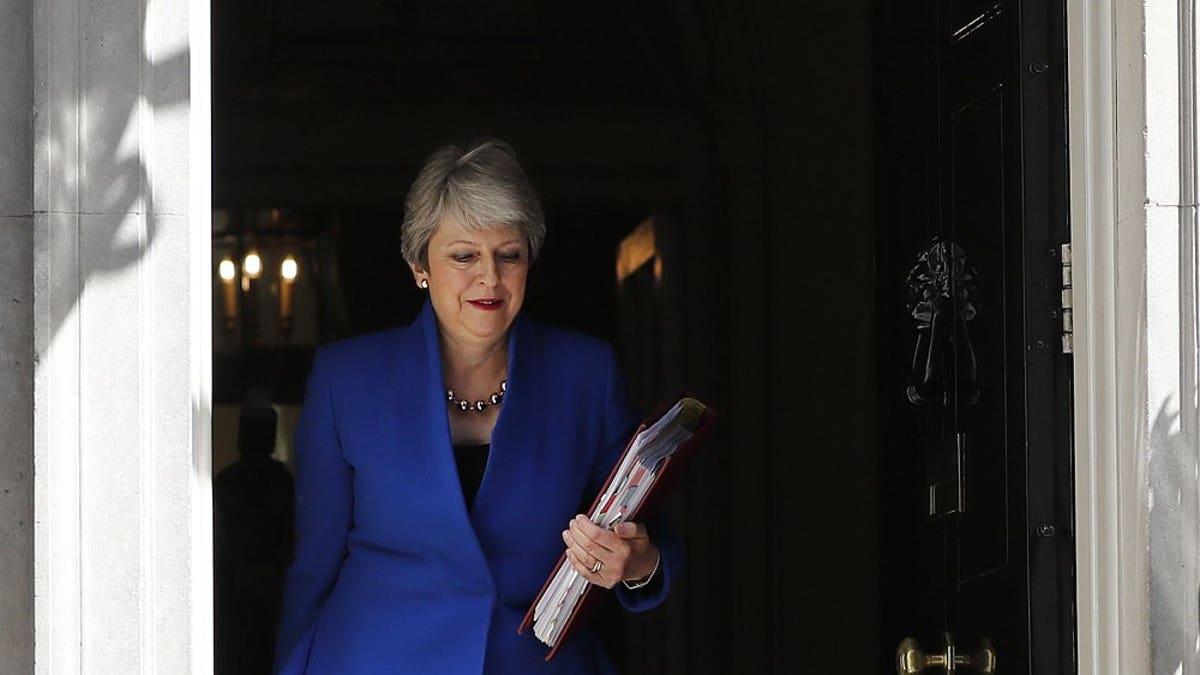 Britain's Prime Minister Theresa May leaves 10 Downing Street, for the House of Commons to attend Prime Minister's Questions in London, Wednesday, July 24, 2019. Boris Johnson will replace May as Prime Minister later Wednesday, following her resignation last month after Parliament repeatedly rejected the Brexit withdrawal agreement she struck with the European Union.