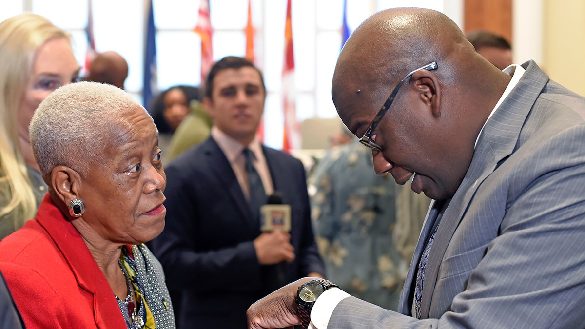 In a Friday Dec. 29, 2017, photo, Sadie Roberts-Joseph chats with Louisiana State Police Lt. Col. Murphy Paul.